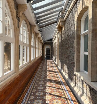 A decorative Victorian encaustic tile corridor at UWE Glenside