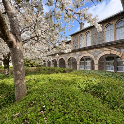 Architecture and architectural details at former Glenside Hospital in Fishponds, Bristol. Shown among spring blossom trees during a walking tour trail