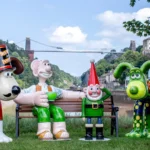 Wallace and Gromit sculptures in front of the Clifton Suspension Bridge